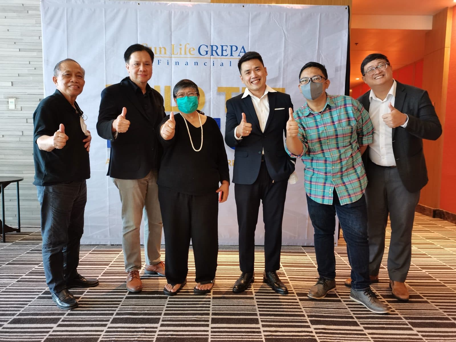 Kuya Aries with his Sun Life Grepa team at an awards night
