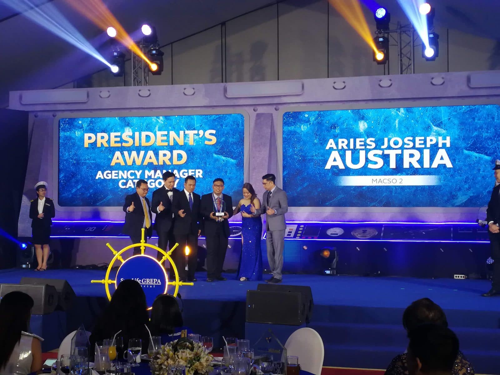 Aries Joseph Austria named on stage at a Sun Life Grepa awards night